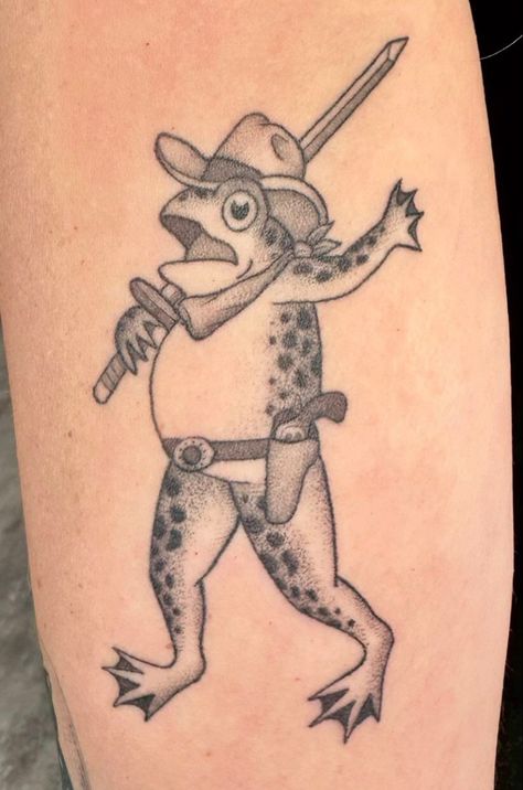 Silly tattoo of frog with cowboy hat Frog King Tattoo, Frog With Cowboy Hat Tattoo, Cowboy Frog Tattoo, Frog With Cowboy Hat, Cowboy Hat Tattoo, Hat Tattoo, Cowboy Frog, Frog Tattoo, King Tattoos