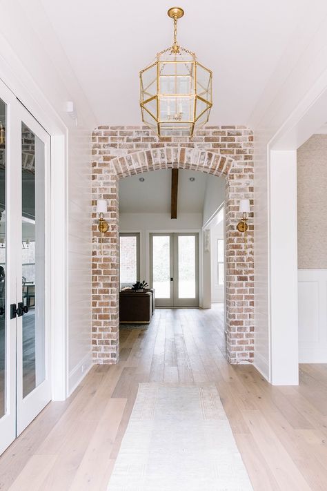 Brick Archway In Kitchen, Archways In Homes, Transitional Entry, Brick Archway, Home Entry, Brass Wall Sconces, Interior Brick, Farm Road, Brick Interior