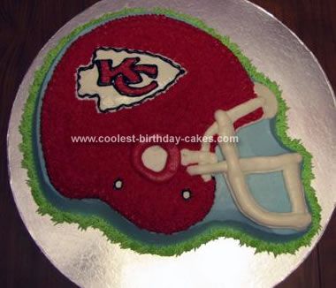 Homemade Chiefs Helmet Cake: I used the Wilton's Football Helmet Pan for this Chiefs Helmet Cake . Flat iced the sides and other areas needed with light blue. Used a grass tip with Football Helmet Cupcake Cake, Chiefs Party, Football Helmet Cake, Nfl Cake, Football Chiefs, Chiefs Helmet, 70th Cake, Chiefs Superbowl, Superbowl Cake