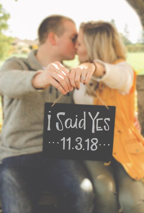 She said Yes! The future groom decided to surprise his girlfriend during our anniversary session. Loving everything about this fall engagment. A must have is showing off that ring with a chalkboard sign with the date of their engagement on it! Click on the photo to see more pictures from this fall engagement session. Repin and like to share these ideas with your followers! Fun Engagement Photos Props, Signs For Engagement Pictures, She Said Yes Engagement Photos, Engagement Photo Sign Ideas, Engagement Photo Signs, Engagement Photos Signs, Engagement Signs For Pictures, Engagement Photos With Signs, She Said Yes Photos