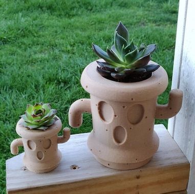 Animal Crossing Gyroid, Bulbasaur Planter, Animal Crossing Amiibo, Gifts For Gamers, Frog Statues, Animal Crossing Wild World, Goddess Statue, Small Succulents, Animal Crossing Game