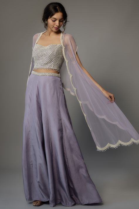 Featuring a lavender cape in net base with pearl and cutdana work. It is paired with a matching bustier and silk satin sharara pants. . #perniaspopupshop #whatiworewastrending #ppuslove #malasa #sharara Lavender Traditional Outfits, Satin Sharara, Purple Sharara, Sharara Outfit, Sharara Outfits, Ridhima Bhasin, Cutdana Work, Sharara Pants, Lavender Silk