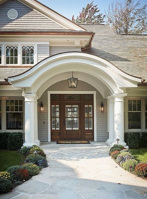 LOVE COVERED ROOF above door. LOVE curved rooftop as well as curve underneath, round pillars, round detail and change in material near peak Arched Entry Doors, Home Designs Exterior, Front Porch Design, Cape House, Casas Coloniales, House With Porch, Front Entrance, Front Door Design, Porch Design