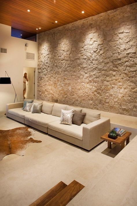 stone-wall-dining-room-wall-decor-ideas-beige-sofa-wooden-side-table Stone Wall Interior Design, Stone Walls Interior, Tv Fal, Modern Family House, Ceiling Design Living Room, Accent Walls In Living Room, Wood Ceiling, Stone Walls, Interior Wall Design