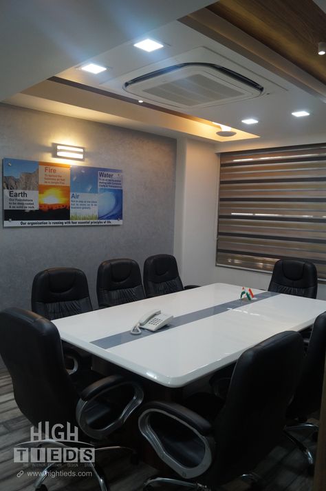 with 8 Seating Arrangement which includes Glossy Finished Conference table made with Extra ordinary PU Material which gives Corporate Looks to the office, 8 Table Chairs, Wall Texture, Zebra Blind Curtains, Wooden Flooring and matching Wooden Texture on Ceiling, Wall Lights which highlights the quote picture / image / poster, Panel Lights, Hanging lights, Surface lights, Cassette Air Conditioner. Cassette Air Conditioner Ceiling Design, Cassette Ac False Ceiling Design, Ac Ceiling Design, Cassette Ac Ceiling Design, Ceiling Air Conditioner, Earphones Wrap, Conference Room Design, Carrara Marble Tile, Quote Picture