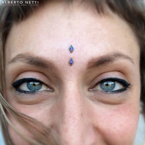 One of my favorite piercing 😎 Fresh Vertical Bridge with purple opal rhombus 💜 @hivetattooartgallery #verticalbridge #surface… | Instagram Vertical Bridge Piercing, Rare Piercings, Vertical Philtrum Piercing, Purple Piercings, Bridge Piercing Jewelry, Jestrum Piercing, Face Dermal Piercing, Third Eye Piercing, Face Dermal