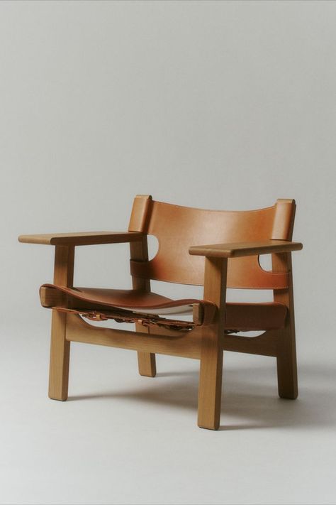 The iconic Spanish Chair is Børge Mogensen’s masterful contribution to modern design, designed for Fredericia in 1958. Solid oak or walnut combined with the highest calibre saddle leather creates a strong presence in a chair that will only become more beautiful with age - displayed in the picture. #fredericiafurniture #thespanishchair #borgemogensen #craftedtolast #modernoriginals #vintage #patina Spanish Chair, Ornate Chairs, Tan House, Medieval Furniture, Borge Mogensen, Bars And Clubs, Saddle Leather, Light Oak, Architect Design