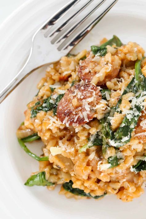 This oven-baked chicken and chorizo risotto with spinach and sun dried tomato pesto is a rich, creamy and comforting meal. Made with a handful of basic ingredients, chicken chorizo risotto is a delicious weeknight dinner that the whole family will love! Just 20 minutes prep time and ready to eat in under 50 minutes. #chicken #chorizo #risotto #italian #dinner Chicken And Chorizo Risotto, Chorizo Risotto, Sun Dried Tomato Pesto, Chicken And Chorizo, Chicken Risotto, Chicken Chorizo, Easy Chicken And Rice, Chicken Breast Fillet, Tomato Pesto