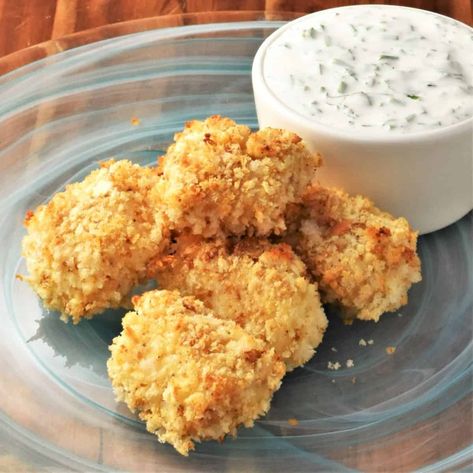 Making your own fish nuggets is easier than you might think. Made with just a handful of simple ingredients they are baked to crispy perfection and come with a hint of lemon. They are delicious, healthy and guaranteed to be a hit with the whole family! #fishnuggets #breadedfish #crispyfish #codnuggets #everydayhealthyrecipes Fried Catfish Nuggets, Fish Nuggets, Sweet Peas And Saffron, Air Fried Fish, Sole Fish, Healthy Chicken Nuggets, Deep Fried Fish, Fish Dinners, How To Make Fish