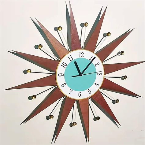 PRICES MAY VARY. Unique Mid-Century Design: Inspired by the timeless charm of mid-century design, the Clock is a unique and eye-catching addition to any home. With its distinctive sunburst shape, this clock effortlessly combines elegance and style Vibrant and Stylish: The Clock adds a touch of vitality to any space. Its vibrant colors and intricate design make it a statement piece that captures attention and elevates the overall aesthetic of your home decor Perfect for Mid-Century Lovers: If you Mid Century Modern Lights, Mid Century Modern Clocks, Big Wall Clock, Sunburst Clock, Living Room Retro, Large Digital Wall Clock, Big Wall Clocks, Room Retro, Wall Living Room