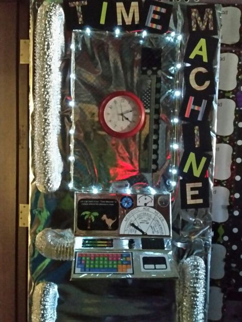 Time Machine Dinosaurs Time Machine Door Decoration, Time Machine Classroom Door, Time Machine Craft, Clock School Project, Time Machine Decorations, Decades Dance, Time Travel Machine, Book Fair Ideas, Fair Theme