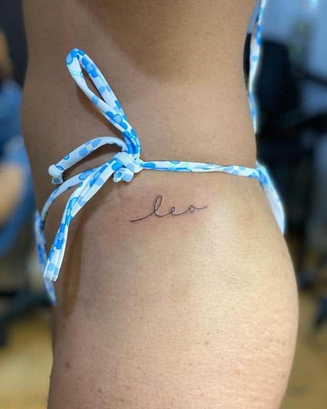 Leo Cursive Tattoo, Leo Tattoo On Finger, Leo Name Tattoo Ideas, Elegant Leo Tattoo, Leo In Cursive, Leo Word Tattoo, Dainty Leo Tattoos, Leo Neck Tattoo, Small Leo Tattoos For Women