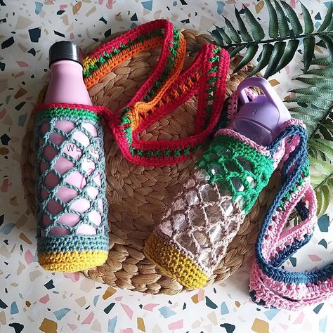 Made a couple of water bottle carriers using up all the 'ends' left over from coasters, wash cloths, scrubbies and other carriers all joined with a magic join to make a huge ball of cotton yarn. Each is a one of a kind because of the different lengths of the joined yarn. Worth adding to the @folksyhq Craft Drop do you think? . . #folksyshop #folksynorthwest #folksycraftdrop #folksyseller #shopsmall #shophandmade #shophandmadeuk #craftcolourmyday #nowaste #crochetersofinstagram #crochetallthe... Cross Body Water Bottle Holder, Crochet Bottle Holder, Crochet Bottle Cover, A Bottle Of Water, Crochet Water Bottle Holder, Bottle Of Water, Water Bottle Carrier, Water Bottle Covers, Water Bottle Holder