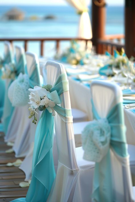 Dive into a sea of love with an oceanic touch! 💙 Our coastal-influenced wedding setup evokes the serenity of the beach using pristine whites and a spectrum of blues. Perfect for your I dos by the shore or to bring that seaside charm inland. #WeddingInspiration #BeachWedding #BlueAndWhite #WeddingDecor #ChairCovers #Sashes #CoastalChic #OceanWedding Beach Wedding Games, Aquatic Wedding Theme, Ocean Wedding Ideas, Blue And White Beach Wedding, Blue And Orange Wedding, Wedding Chair Decor, Nautical Wedding Inspiration, Blue Beach Wedding, Sea Of Love