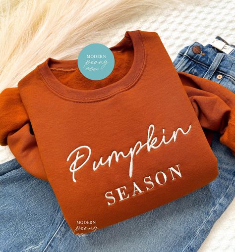 Fall Sweatshirt Embroidered, Pumpkin Season Pumpkin Crewneck Sweatshirt Pumpkin Shirt, Pumpkin Sweater, Autumn Shirt Thanksgiving Sweatshirt ---HOW TO ORDER---   FOR EACH SHIRT CHOOSE: **Shirt type, size and color ---UNISEX SIZING--   Please see size chart in the pictures ---PRODUCT DETAILS--- Gildan Crewneck UNISEX Sweatshirt 50% cotton, 50% polyester Pre-shrunk Air jet yarn for softer feel and reduced pilling Double-needle stitched collar, shoulders, armholes, cuffs, and hem Gildan Crewneck UN Pumpkin Crewneck, Embroidered Pumpkin, Fall Carnival, Pumpkin Sweater, Nice Tattoos, Carnival Ideas, Fall Crewneck, Thanksgiving Sweatshirt, Pretty Pumpkins