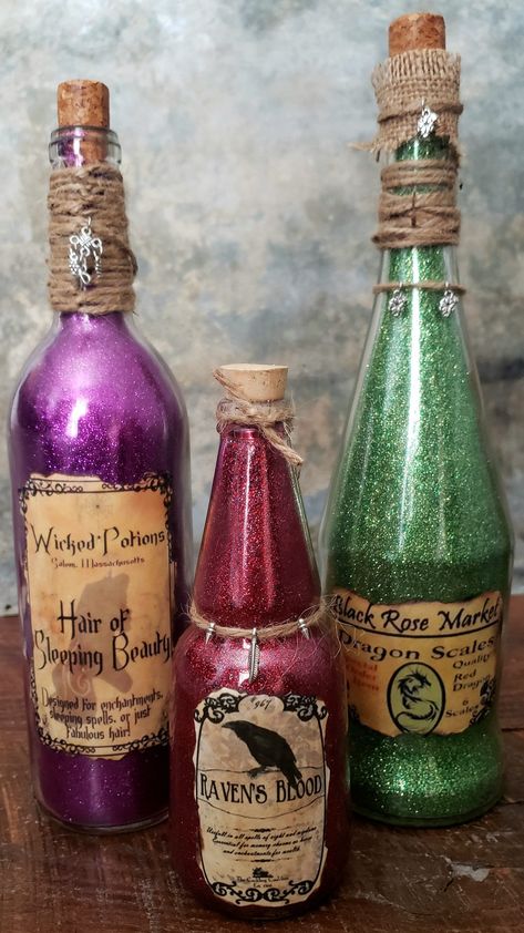 **Contact me for additional shipping rates if shipping to your area is high** Three Apothecary themed bottles. They are approx 6" to 14" tall and are finished *inside* with a glitter finish so no mess. Great for Halloween fan or even just fun decor. Custom orders are available Fantasy Themed Decor, Sleeping Beauty Hair, Apothecary Potions, Witch Potions, Halloween Alcohol, Halloween Food Dinner, Halloween Potion Bottles, Colored Glass Bottles, Halloween Bottles