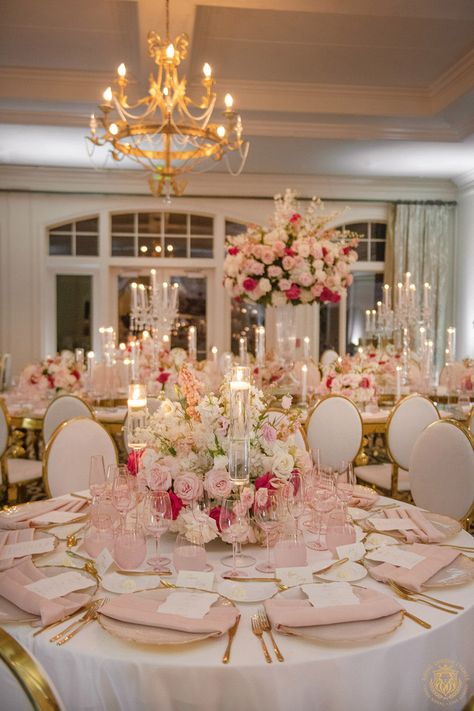 Kristi & Alex’s stunning country club wedding featured pink and white wedding decor. The outdoor ceremony included large pink and white floral arches draping over a mirrored aisle. The wedding reception featured gold and crystal decor with pink & white centerpieces, candelabras and pink glassware. | Floral, Decor, Production, Rentals: Royal Luxury Events / Photo: Jessica Frey Photography | wedding table centerpieces, low floral arrangements, wedding reception decor, pink wedding flowers, elegant Blush Pink Wedding Centerpieces Diy, White Pink And Gold Wedding Decor, Flowers On Candelabras Wedding, Table Reception Wedding, Pink And White Debut Theme, Circle Wedding Centerpieces, Pink And White Engagement Decor, Pink Decor Table, Wedding Centerpieces Pink And White