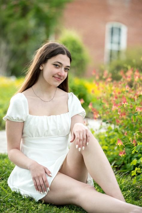 Senior girl sitting in grass in a white dress next to flowers with a brick building in the background at Shaw Nature Reserve in Gray Summit, Missouri near St. Louis, Missouri. Photograph by Amanda Photography. #stlouisseniorpictures #stlseniorphotographer #stlouisseniorphotographer #sittinggirlpose Senior Pictures With Flowers, Senior Pictures In A Field, Female Senior Portraits, Senior Pictures Locations, Spring Senior Pictures, Flowers For Her, Outdoor Senior Pictures, Indian Railways, Wild Love