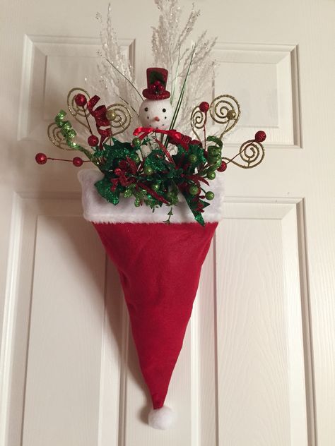 Santa hat door decor for under $10-Dollar store hat, brick of foam, 6 floral picks on sale 50% off-fill the front only! The way it hangs you cannot tell it's not full up! Clip a binder clip on the back  and hang it over the wreath hanger or a nail!!! Front Door Christmas Decor Ideas, Diy Dollar Tree Christmas Decor, Diy Dollar Tree Christmas, Dollar Tree Christmas Decor, Front Door Christmas Decorations, Simple Christmas Decor, Dollar Tree Christmas, Pretty Christmas, Home Christmas