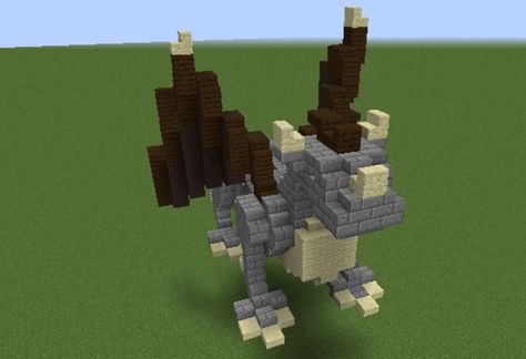 Dragon Statue - GrabCraft - Your number one source for MineCraft buildings, blueprints, tips, ideas, floorplans! Minecraft Small Statue Design, Minecraft Build Statue, Minecraft Small Dragon Statue, Animal Statue Minecraft, Minecraft Dragon Statue, Minecraft Viking Statue, Minecraft Mountain Castle, Vikings Statue, Minecraft Kingdom