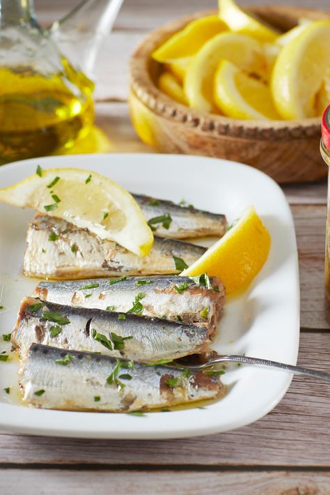 These amazing sardines are prepared 'a la Antigua' – hand cleaned and slow cooked in virgin olive oil. Enjoy these exceptionally tender and mild sardines with crackers, on a canapé or add to a fresh green salad. Packed with beneficial oils, calcium and vitamins, sardines are one of the healthiest fish you can eat. #Spain #Spanish #Food #SpanishFood #Tapas #Gifts #Latienda #Tienda #Seafood #SeafoodLover #CannedSeafood #Sardines #seafoodie #seafoodplatter #seafoodlove #seafoodporn #iloveseafood Dried Sardines, Healthiest Fish, Foods From Spain, Healthy Ham, Spanish Foods, Canned Seafood, Spain Spanish, Seafood Platter, Honey Almonds