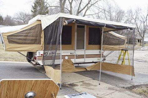 So the Pop Up Camper Redo has begun. Here is the camper all popped out with the crazy awning/screen room. The screen room doesn't really wo... Popup Remodel, Tent Trailer Remodel, Tent Trailers, Popup Camper Remodel, Pop Up Tent Trailer, Camper Repair, Camper Redo, Pop Up Trailer, Cabinets Painted