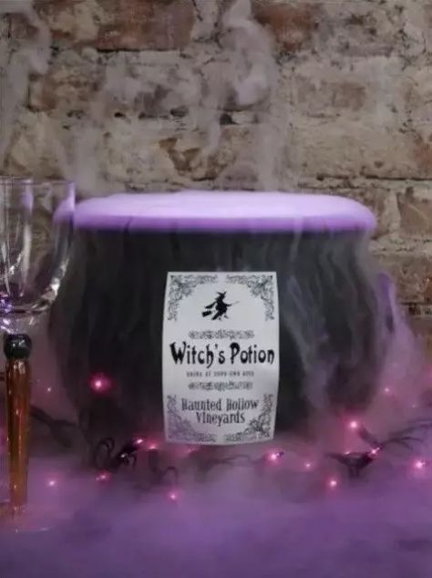 a cauldron with purple fog potion and lights is amazing and very eye catchy for Halloween decor Cauldron Halloween Decor, Witch Halloween Decor, Decorations For Halloween, Spooky Ideas, Witch Supplies, Halloween Tablescape, Witch Party, Halloween Decor Ideas, Halloween Front Doors