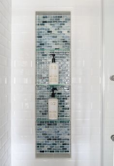 Shower Niche With Glass Shelf, Blue Glass Bathroom Tile, Vertical Shower Niche With Shelves, White Shower With Niche, White And Blue Shower Tile Ideas, Blue Accent Tile Shower Wall, Verticle Tile Bathroom, Blue Bathroom Shower Tile, Blue Tiled Shower Ideas