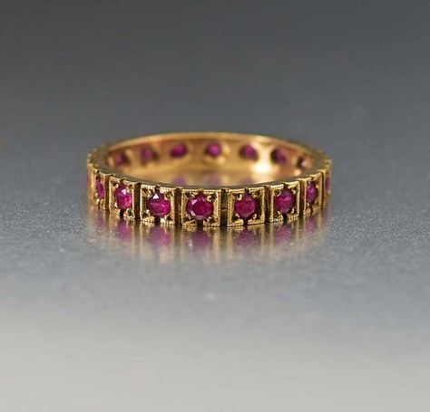 Featuring ruby gemstones all around, this charming vintage English Edwardian eternity wedding band ring is a wonderful love token. Each red stone is set in a millgrain frame with the ring crafted in a 9ct yellow gold. The natural rubies glow and are a wonderful coloring against the gold. Wear as a stacking ring, weddin Antique Jewellery Online, Antique Wedding Rings, Antique Jewelry Indian, Mexican Jewelry, Antique Gold Jewelry, Gold Rings Fashion, Gold Rings Jewelry, Gold Ring Designs, Bangles Jewelry Designs