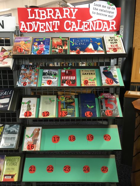 It's the library advent calendar! Each book displayed has a number from 1-25 in the title, with a new title added each day until Christmas #librarydisplay Christmas Decor Ideas In Library, Library Book Displays December, Holiday Book Display Ideas, Library Displays Christmas, Christmas Bulletin Boards For Library, Library Advent Calendar, Christmas Display Library, Winter Reading Programs For Libraries, Book Return Box Ideas