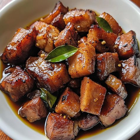 🍽️🥥 Dive into the irresistible Sweet and Savory Pork Adobo—a perfect balance of flavors that’ll make every meal memorable! 🇵🇭🍴 #PorkAdobo #FilipinoFlavors Sweet and Savory Pork Adobo Ingredients: Pork belly (1 lb, cubed) Soy sauce (1/4 cup) Vinegar (1/4 cup) Brown sugar (2 tbsp) Garlic (4 cloves, minced) Bay leaves (2) Peppercorns (1 tsp) Water (1 cup) Oil (2 tbsp) Instructions: Sauté garlic in oil, then brown pork belly. Add soy sauce, vinegar, brown sugar, bay leaves, peppercorns, and w... Pork Belly Meals, Adobo Aesthetic, Adobo Ingredients, Pork Belly Adobo, Adobo Pork, Korean Pork Belly, Food Studies, Pork Adobo, Pork Belly Recipes