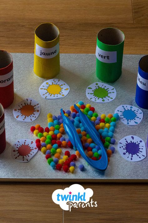 Looking for activities about colours in French for kids? This french colour sorting tray is an engaging way to help your little one master their French colours. Simply paint some toilet paper rolls and follow the link to download our french colour splats. Who knew that learning French could be so fun? #ColoursInFrenchForKids #FrenchColourActivities #FrenchColourGames Colours Kindergarten, French Activities For Preschoolers, France Eyfs Activities, French Colours Activities, French Activities For Kids, France Kindergarten Activities, Colour Matching Activities Eyfs, France Activities For Kids, French Colours Worksheet