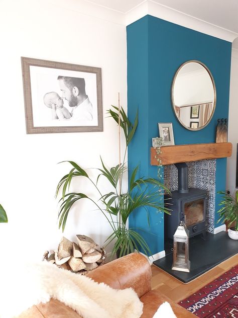 Teal Fireplace Wall, Turquoise Fireplace, Boho Living Room Fireplace, Teal Fireplace, Fireplace Woodburner, Bright Boho Living Room, Painted Fireplaces, Blue Fireplace, Wooden Fire Surrounds