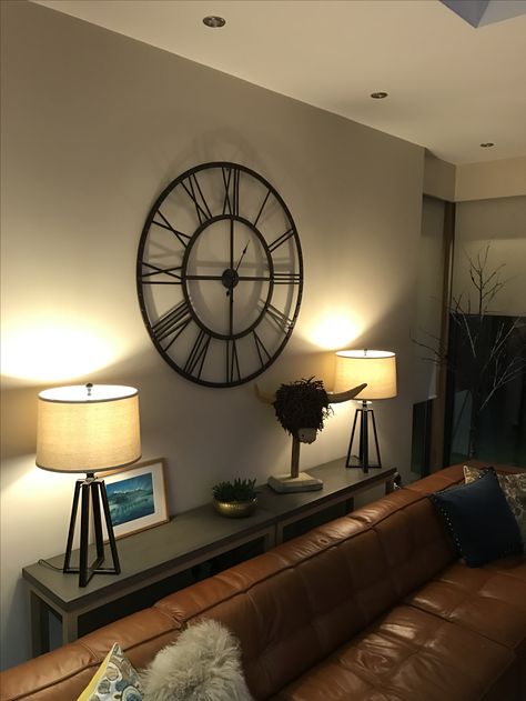 Large clock over console table Wall Clock Living Room Ideas, Clock Behind Couch Decor, Dining Room Clock Wall Decor, Ledge In Living Room, Big Clock Decor Living Rooms, Big Wall Clock Decor Ideas, Wall Clock Dining Room, Big Wall Clocks Living Rooms, Loft Decorating Ideas Upstairs