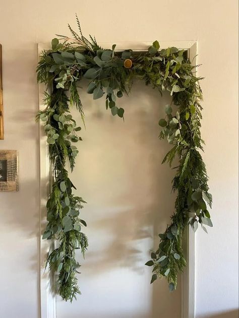 Garland On Doorframe, Shower Curtain Garland Hack, Tension Curtain Rods Ideas, Garland On Picture Frame, Tension Rod To Hang Garland, Door Frame Garland, Shower Rod Garland Christmas, Christmas Garland On Curtain Rod, Tension Rod Garland Hack