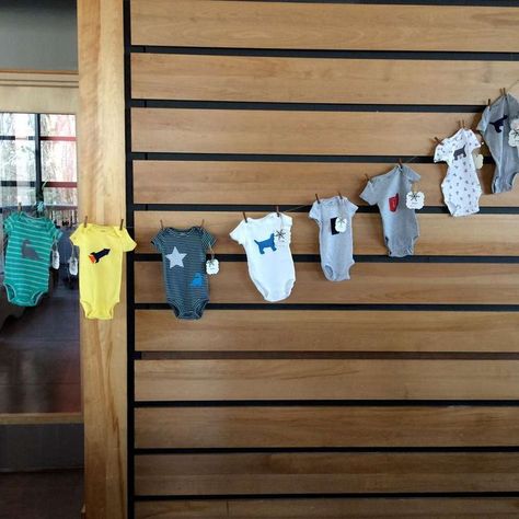 Brighten up a baby shower by putting decorated onesies from the decorating station on display on a clothesline! Such a great idea and a beautiful keepsake! See more party ideas and share yours at CtachMyParty.com Diy Baby Socks, Trendy Baby Gifts, Baby Shower Party Planning, Baby Boy Shower Party, Outside Baby Showers, Baby Shower Cakes For Boys, Birthday Party Activities, Baby Shower Photos, Baby Gift Basket