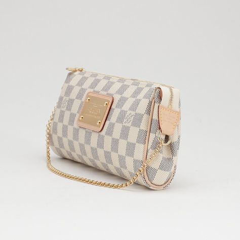 Louis Vuitton Eva Canvas Clutch Bag in Damier AzurThis elegant Louis Vuitton Damier Azur Canvas Eva Clutch Bag is ideal for holding your cosmetics and girly essentials in a fun and elegant manner! The Eva can be converted to a wrist strap with its goldtone strap or carried across the chest with its long, removable leather strap. Whatever you're mood is for the night, this bag is the perfect accessory. Purchase Worn by Princess Charlene on:27 July 2012 Louis Vuitton Eva Clutch Damier Azur, Girly Essentials, Louis Vuitton Eva Clutch, Louis Vuitton Eva, Princess Charlene, Canvas Clutch, Louis Vuitton Damier Azur, Lv Bag, Wrist Strap