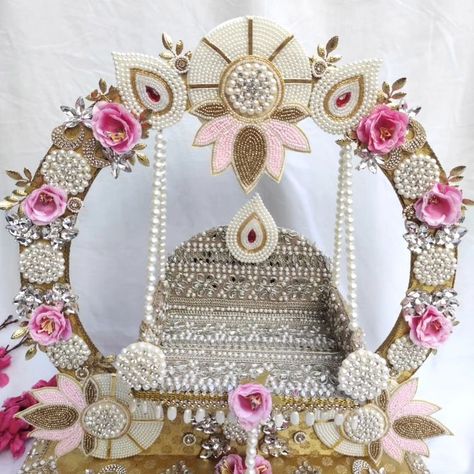 Beautiful 🥰 ..Designer ...Heavy look ..Royal ..Antique work of pearl and shiny stones ✨✨..Zula for our loved Ladoo Gopalji ... Size 12 inch.. Work on heavy board Completely detachable. DM us for more details or WhatsApp us on 9867422790 Jhoola Decoration For Janmashtami, Balauj Design, Ladoo Gopal Decoration, Jhoola Decoration, Ladoo Gopal Jhula, Ganpati Backdrop, Ganpati Aarti, Krishna Jhula, Ganesh Decoration