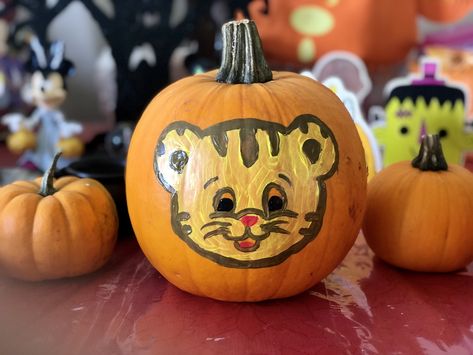 Daniel Tiger Pumpkin painting Daniel Tiger Pumpkin, Tiger Pumpkin Carving, Tiger Pumpkin, Pumpkin Creations, Daniel Tiger Party, Story Book Pumpkin, Tiger Party, Samhain Halloween, Daniel Tiger