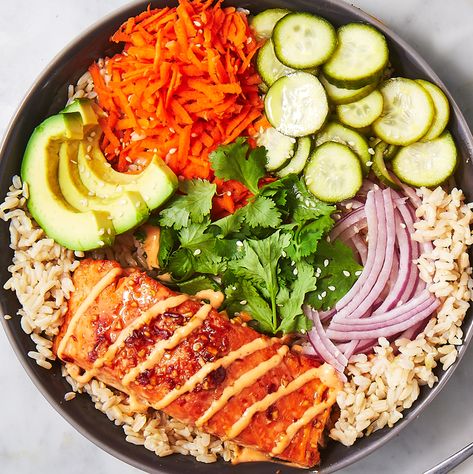 Spicy Salmon Bowls - Delish.com Spicy Salmon Bowl, Salmon Bowls, Quick Pickled Cucumbers, Salmon Bowl, Spicy Salmon, Asian Noodles, Tempura, Bowls Recipe, Salmon Recipes