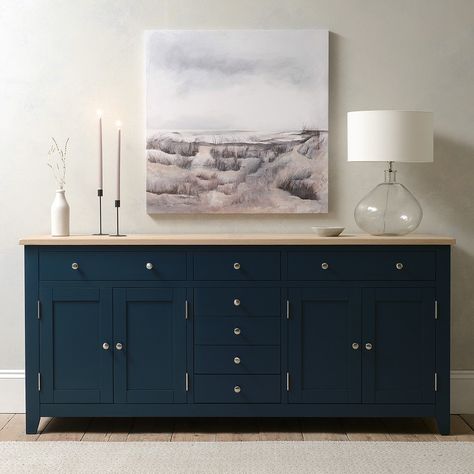 Our Chester Midnight Blue Grand Sideboard is a stunning addition to any dining area or room, not only providing masses of storage for crockery, tableware and accessories but also giving you plenty of surface space which is great for entertaining as you can layout an impressive buffet or set up a serving area. The natural oak top is finished with oak veneers and a white wax and clear lacquer to protect the surface from minor bumps and scratches. Important Information Regarding Delivery: Please be Navy Buffet Sideboard Dining Room, Navy Blue Buffet Sideboard, Navy Blue Sideboard, Navy Buffet Sideboard, Blue Sideboards And Buffets, Blue Buffet Table, Blue Buffet Sideboard, Navy Sideboard, Dark Sideboard