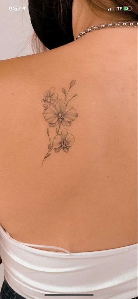 Orchid Flower Tattoos Fine Line, Orchid Tattoo Cattleya, Orkid Flower Tattoo Design, Back Orchid Tattoo, Orchid Tattoo Back For Women, Orchid Back Tattoo Women, Orchid Tattoo Wrist, Orchid Rose Tattoo, Orchid Tattoo On Back