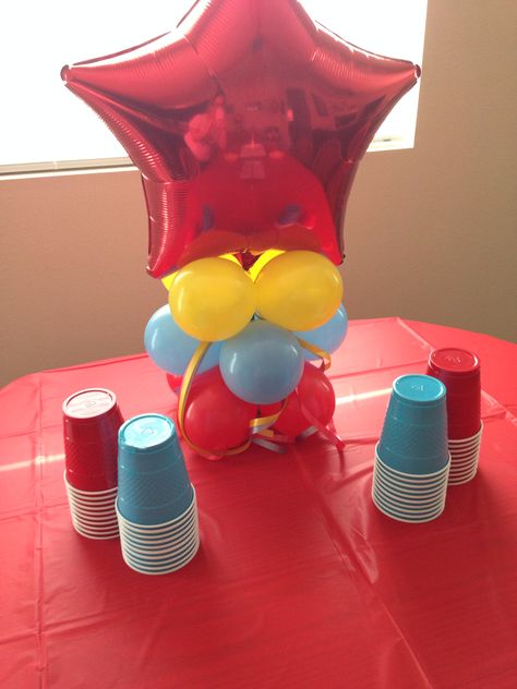 Circus decorations for first birthday party, blue and red cups, balloon centerpiece in red, blue, and yellow Red Blue Yellow Birthday Party Themes, Birthday Party Blue, Yellow Birthday Parties, Curious George Birthday Party, First Birthday Cookies, Balloon Centerpiece, 2nd Birthday Party For Boys, Curious George Party, Circus Decorations