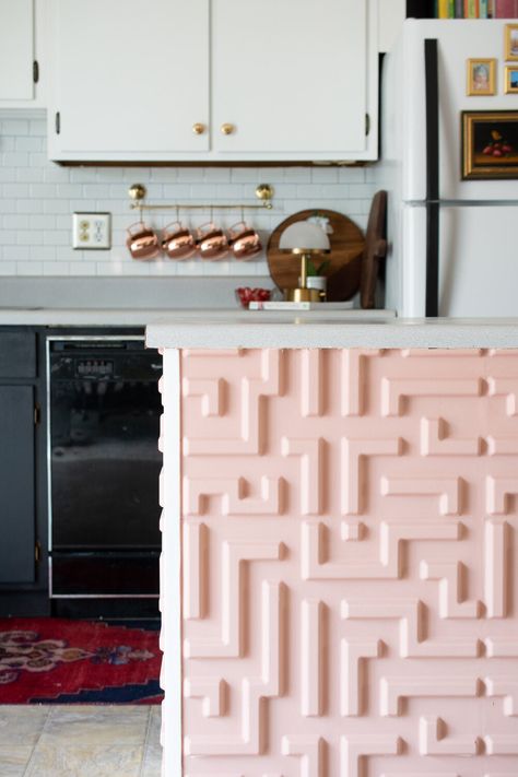 a kitchen peninsula gets a makeover with a bold geometric tile and pink paint Kitchen Update Ideas, Old Oven, Kitchen Peninsula, Rental Kitchen, Geometric Tiles, Peel And Stick Tile, Pink Paint, Modern Light, Modern Light Fixtures