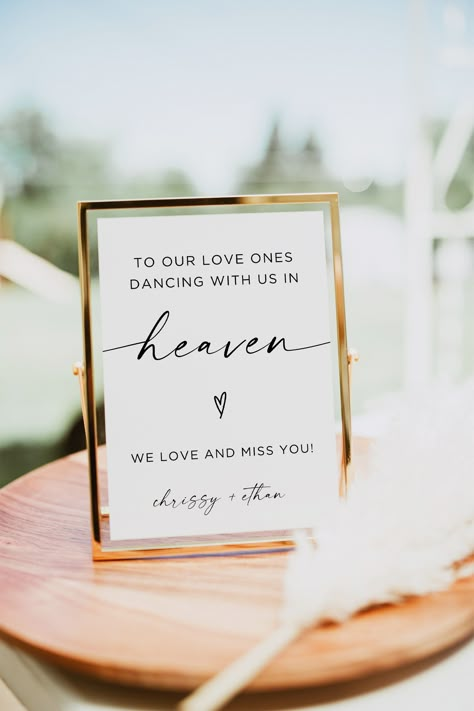 Celebrate the life and love of your cherished ones who are watching over you with our "Dancing With Us In Heaven Sign." This rustic wedding signage is perfect for creating a heartfelt memory table at your special event. Honor your loved one in heaven with a loving memory sign that is both elegant and touching. Our printable wedding remembrance sign will be a beautiful addition to your wedding memory table. Keep their spirit alive on your big day with this loving tribute that will surely warm the Wedding Passed Loved Ones, Wedding In Loving Memory Table, Loved Ones In Heaven Quotes Wedding, Wedding In Loving Memory Ideas, Wedding Ideas For Lost Loved Ones, Honoring Loved Ones At Wedding, In Loving Memory Wedding Ideas, Wedding Memory Table, Memory Table Wedding Display