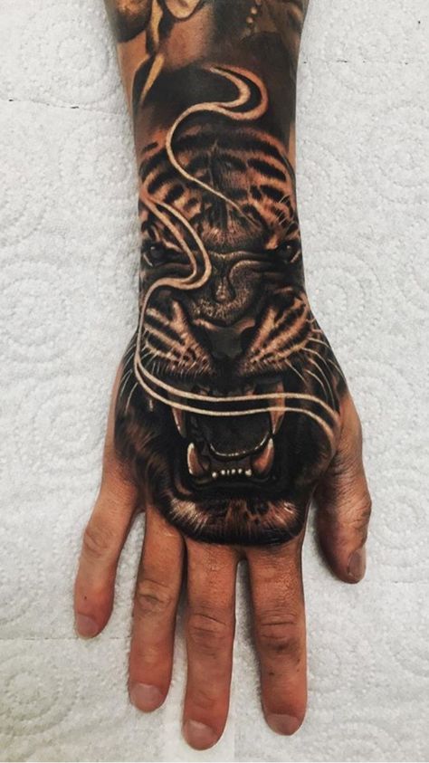 Tiger hand tattoo. Tiger Tattoo For Men, Devils Tattoo, Tattoo Designs Realistic, Tiger Tattoo Designs, Neck Tats, Tiger Hand Tattoo, Tattoo Tiger, Animals In The Wild, Aggressive Animals