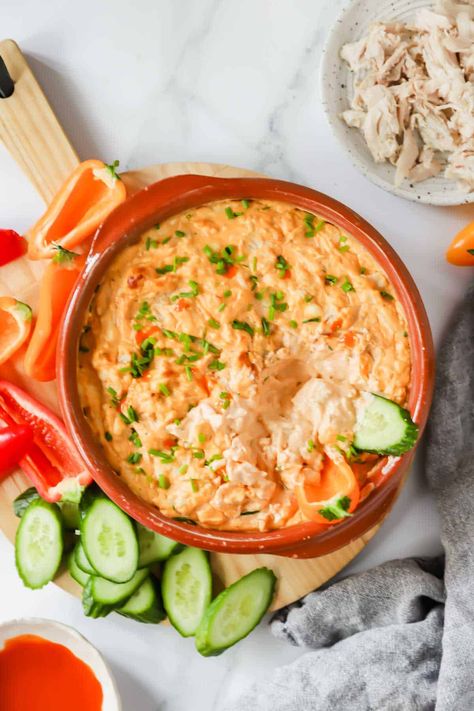 Trader Joe's Buffalo Chicken Dip is the ultimate crowd-pleasing appetizer, and this homemade version is brimming with creamy, spicy, and savory flavors! It showcases a perfect blend of tender rotisserie chicken, rich cream cheese, and zesty buffalo sauce. Serve it with tortilla chips, veggies, or even as a spread for sandwiches. Buffalo Dip, Buffalo Chicken Dip Recipe, Crowd Pleasing Appetizers, Chicken Dip, Cream Cheese Chicken, Chicken Dips, Buffalo Chicken Dip, Buffalo Sauce, Chip Dip