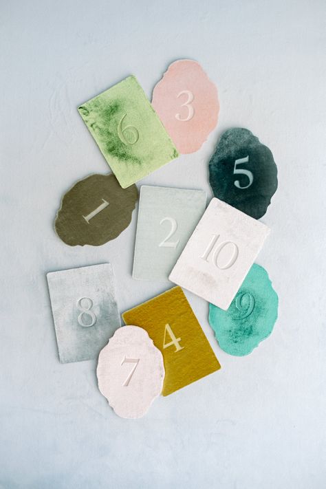 This is a beautiful silk velvet greeting card cut into an oval shape, featuring number printed on it using letterpress printing. The paper has a sturdy thickness of 2mm, utilizing environmentally friendly recycled cardboard. The backside is white, allowing you to write your own message.  [Contents] Card + Envelope, 1 of each (plain backside) *Stand, flowers, ribbons, etc., are not included with the product. [Card Size] 148 × 108mm (5.9 × 4.3 inches) [Envelope Size] 162 × 114mm (6.4 × 4.5 inches)   [This product is accepted as a custom order] Regarding the color you desire, you are generally allowed to choose from what we have in stock in plain colors. We will start making your order after we receive it, so please allow approximately one week from order to delivery. If you order other prod Velvet Table Numbers, Letters To Guests Wedding, Greeting Board, Unique Table Numbers Wedding, Name Place Cards Wedding, Table Labels, Product Card, Place Cards Wedding, Name Place Cards