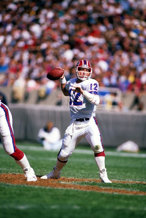 CHICAGO, IL-OCTOBER 1988:  NFL Hall of Fame quarterback Jim Kelly of the Buffalo Bills gets ready to throw a pass during a game against the Chicago Bears at Soldier Field, Chicago Illinois.  Kelly played for the Buffalo Bills from 1986-1996. Soldier Field Chicago, Nfl Hall Of Fame, Nfl Football Helmets, Jim Kelly, Buffalo Bills Football, Nfl Football Players, Bills Football, Nfl Photos, Football Tips