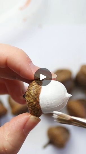 How to Paint an Acorn Garland | photograph | This pretty foraged acorn garland is lovely for a fall mantel or tiered tray! Photos and supply list ->... | By Sustain My Craft Habit - Clever DIY, Crafts & Upcycling IdeasFacebook Painting Acorns Fall, Acorn Garland Diy Christmas, Decorating With Acorns For Fall, Craft With Acorns, Crafts Using Acorns, Painting Acorns Diy, Acorn Ornaments Diy, Acorn Cap Crafts, Acorn Crafts Diy